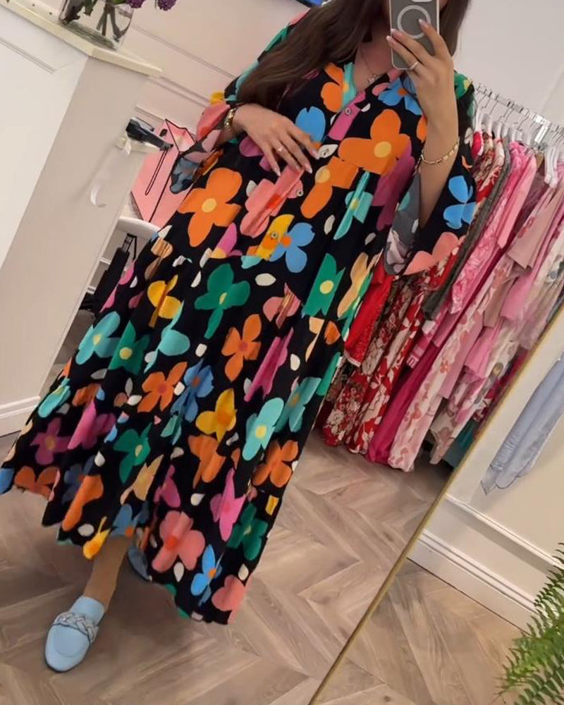 Elegantes Noa Kleid mit Blumen und Trompetenärmeln