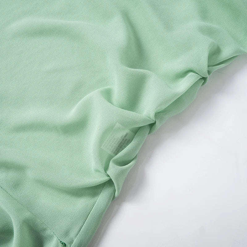 Luftiges, Elegantes Minzkleid mit Rüschenschichten