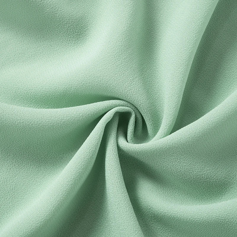 Luftiges, Elegantes Minzkleid mit Rüschenschichten