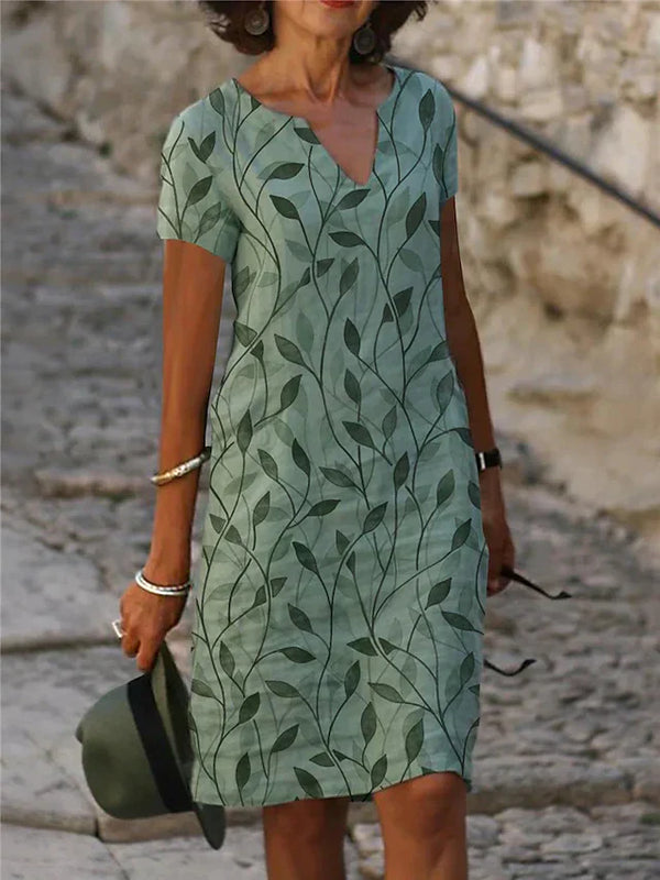 Sabine - Bezauberndes smaragdgrünes Kleid mit zauberhaftem Design